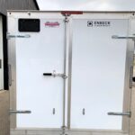 Rear view of a white Enbeck aluminum cargo trailer with dual doors, metal latches, and frame.